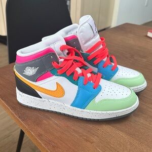 Colorful High-Top Sneakers with Orange Swoosh